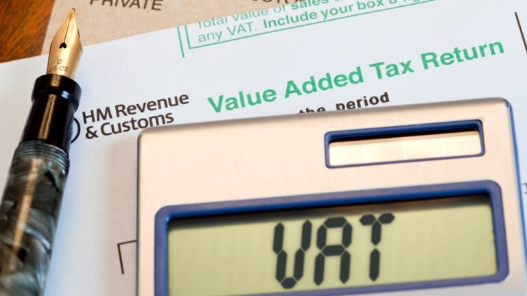 Calculator which reads VAT with penalty paperwork and a fountain pen in the background. Exploring the New VAT Penalty and Interest Regime: What You Need to Know