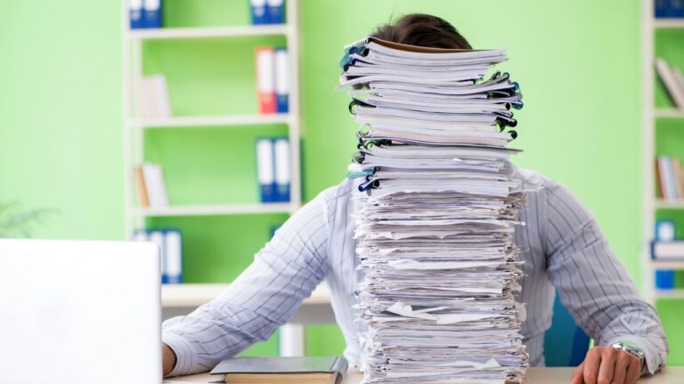 A high stack of tax payment paperwork